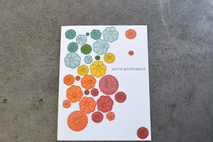 A letterpress greeting card printed with gourds in warm autumn inks