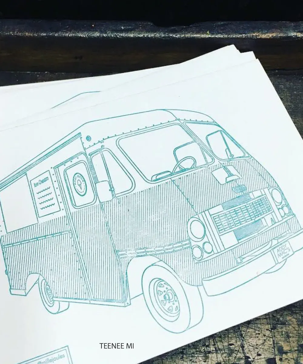 A letterpress print of an ice cream van in fine teal line work, resting on the press